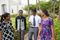 four young people walk outside of the temple 